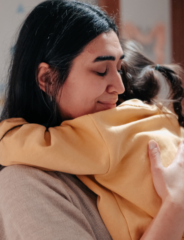 Mother Hugging Child